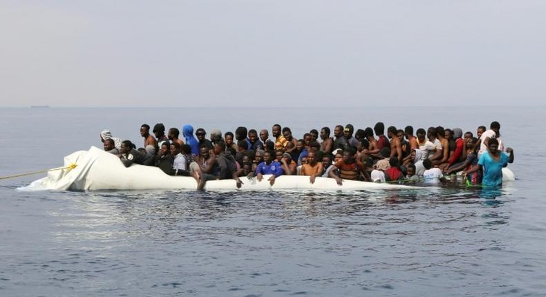 Migrants waiting to be rescued off the Libyan coast