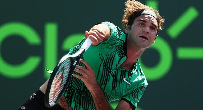 Roger Federer of Switzerland servest against Juan Martin Del Potro of Argentina during their Miami Open 3rd round match, at Crandon Park Tennis Center in Key Biscayne, Florida, on March 27, 2017