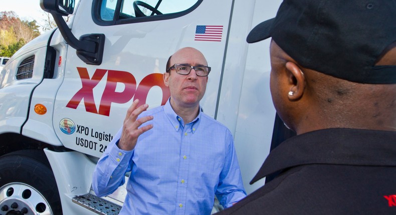 XPO Logistics CEO Brad Jacobs, left, talks with company driver Antoine Seegars.