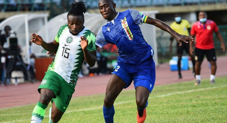 Moses Simon (L) of Nigeria and Saint-cyr Ngam-Ngam (R) of the Central African Republic contest possession during a World Cup qualifier in Lagos on Thursday. Creator: PIUS UTOMI EKPEI