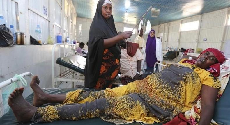 A woman recovers from effects of drinking contaminated water from a well, at a hospital in Yaqshid district in Somalia's capital Mogadishu December 13, 2014. REUTERS/Feisal Omar