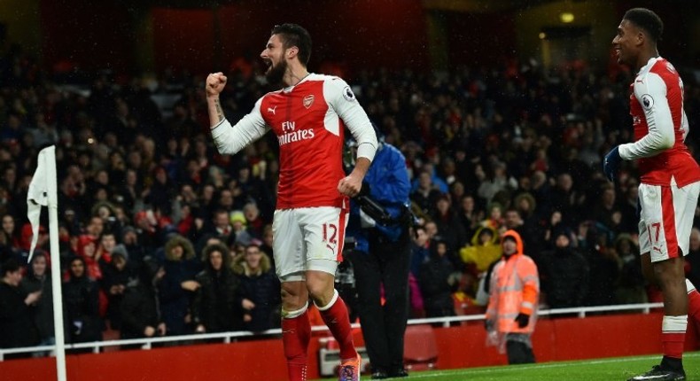 Arsenal striker Olivier Giroud (L) celebrates scoring a goal team manager Arsene Wenger has called a work of art