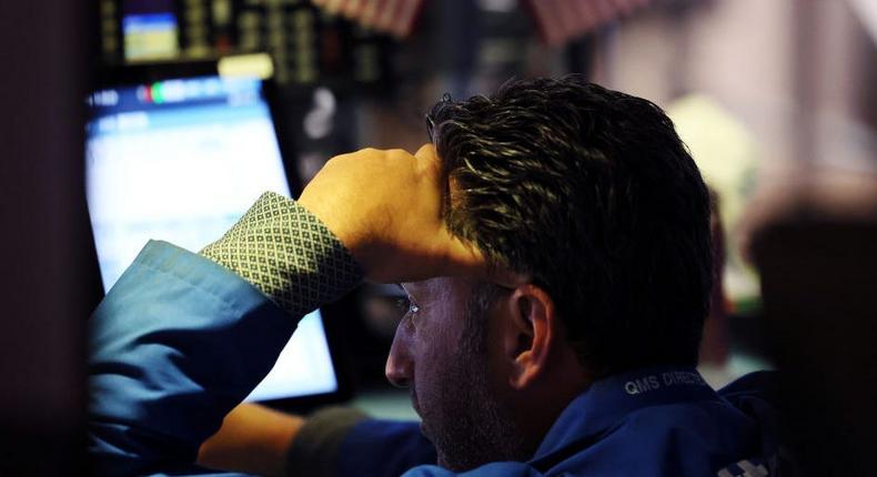 Traders work on the floor of the New York Stock Exchange