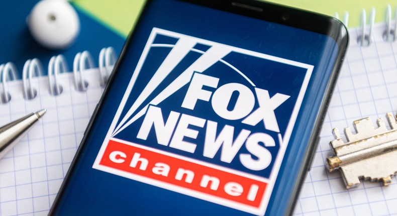 A Fox News logo is seen displayed on a smartphone.
