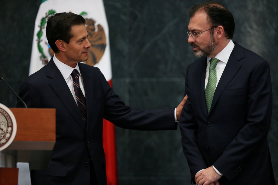 Mexico's new foreign minister, Luis Videgaray, right, with Mexican President Enrique Pena Nieto after he announced new cabinet members at Los Pinos presidential residence in Mexico City, Mexico, January 4, 2017.