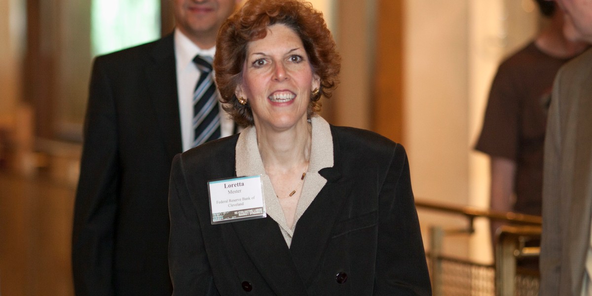 Loretta Mester, President and CEO of the Federal Reserve Bank of Cleveland, walks with James McAndrews (L), vice president of the Federal Reserve Bank of New York, as they arrive for the opening reception of the Jackson Hole Economic Policy Symposium, in Jackson Hole, Wyoming August 21, 2014. 