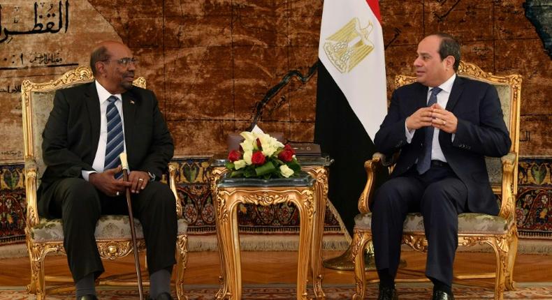 A handout picture released by the Egyptian presidency shows Egyptian President Abdel Fattah al-Sisi meeting with his Sudanese counterpart Omar al-Bashir in Cairo