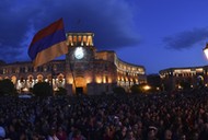 People celebrate after Armenian PM Sarksyan resigned following almost two weeks of mass street protests, in central Yerevan