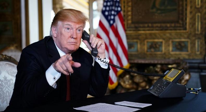 US President Donald Trump speaks to members of the military via teleconference from his Mar-a-Lago resort in Palm Beach, Florida, on Thanksgiving Day, November 22, 2018