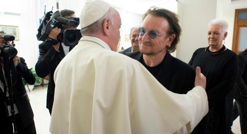 Pope Francis meets U2 singer Bono at the Vatican, where they discussed the abuse scandal rocking the Catholic Church