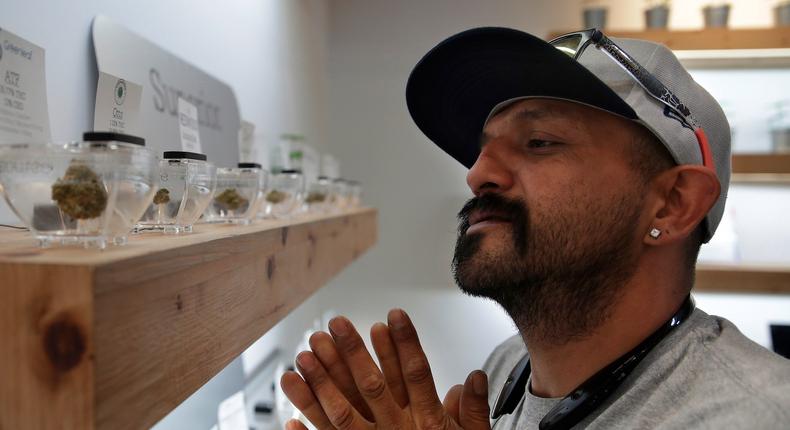 A man shops for marijuana at The Source dispensary, on Saturday, July 1, in Las Vegas.