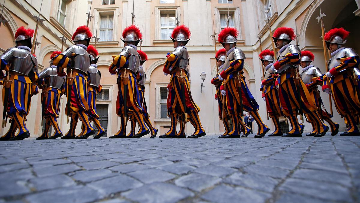 New recruits of the Vatican's elite Swiss Guard march before their swearing-in ceremony at the Vatic