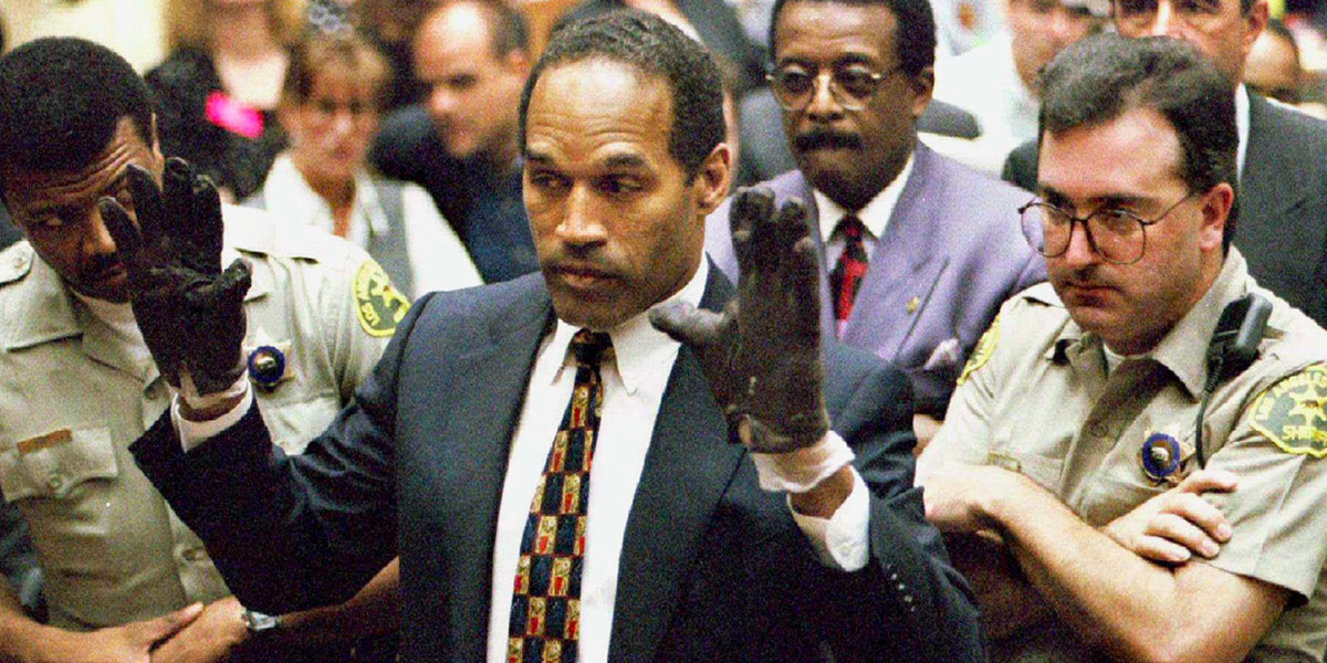 O.J. Simpson trying on the bloody gloves during his murder trial in 1995.