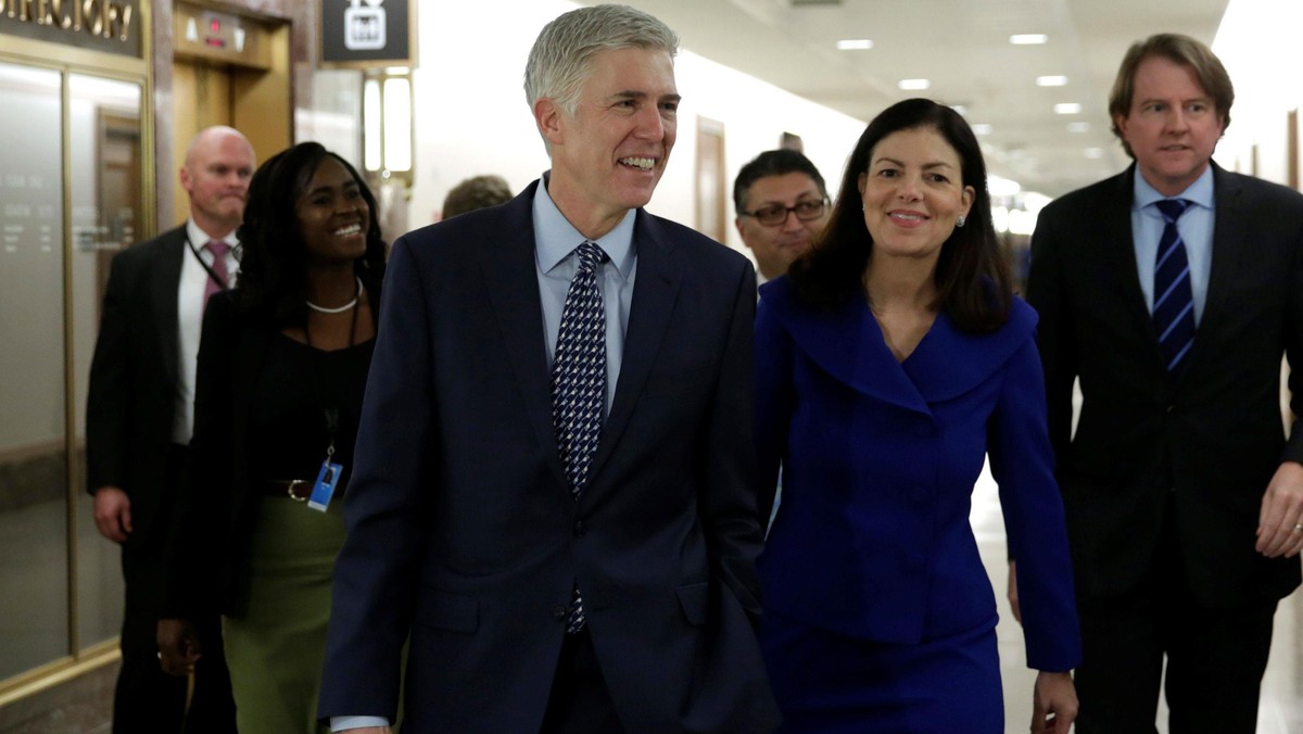 Supreme Court nominee Judge Neil Gorsuch (C) arrives for a meeting with Senator Bob Corker