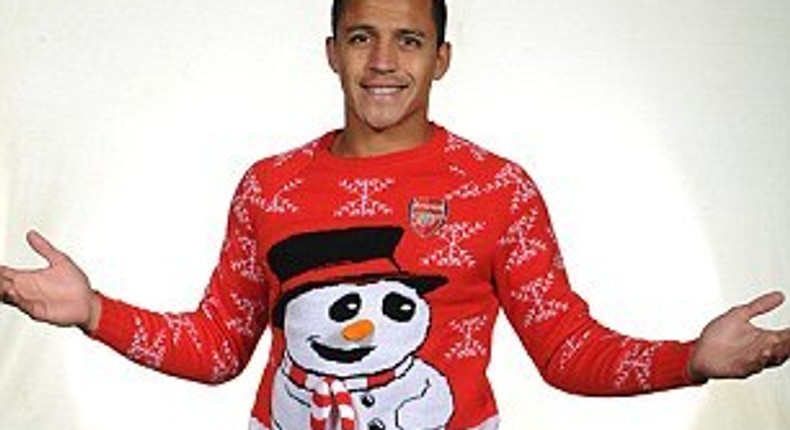 Alexis Sanchez models Arsenal Christmas jumper