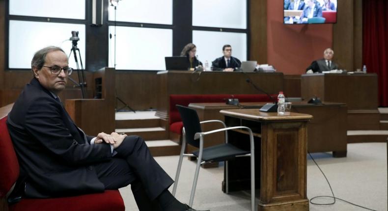 Catalan regional president Quim Torra told the court in Barcelona he had disobeyed orders from electoral authorities to take separatist symbols down from public buildings