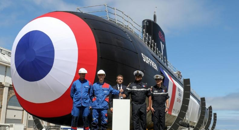 The first of France's new nuclear-powered attack submarines was launched in dry dock by President Emmanuel Macron