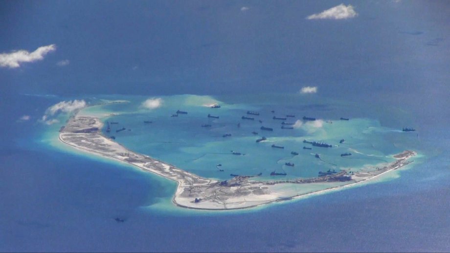 Chinese dredging vessels are purportedly seen in the waters around Mischief Reef in the disputed Spratly Islands in the South China Sea in this image from video taken by a P-8A Poseidon surveillance aircraft provided by the US Navy in 2015.