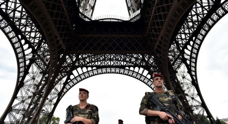 Armed French troops patrol at the Eiffel Tower in Paris