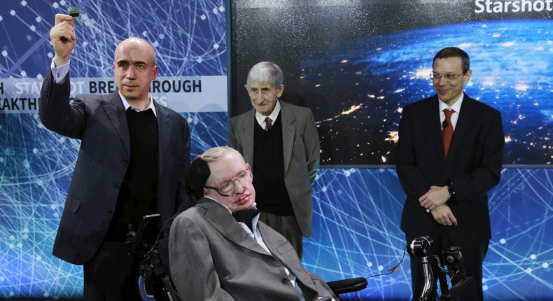 Physicist Avi Loeb, right, on stage with physicist Stephen Hawking and others in New York in 2016.Lucas Jackson/Reuters