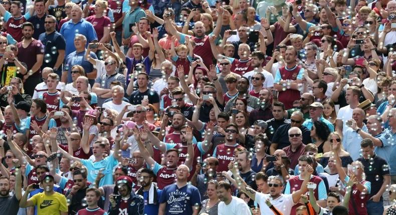 West Ham fans cheer as bubbles fill the air before the kick off of the pre-season friendly football match