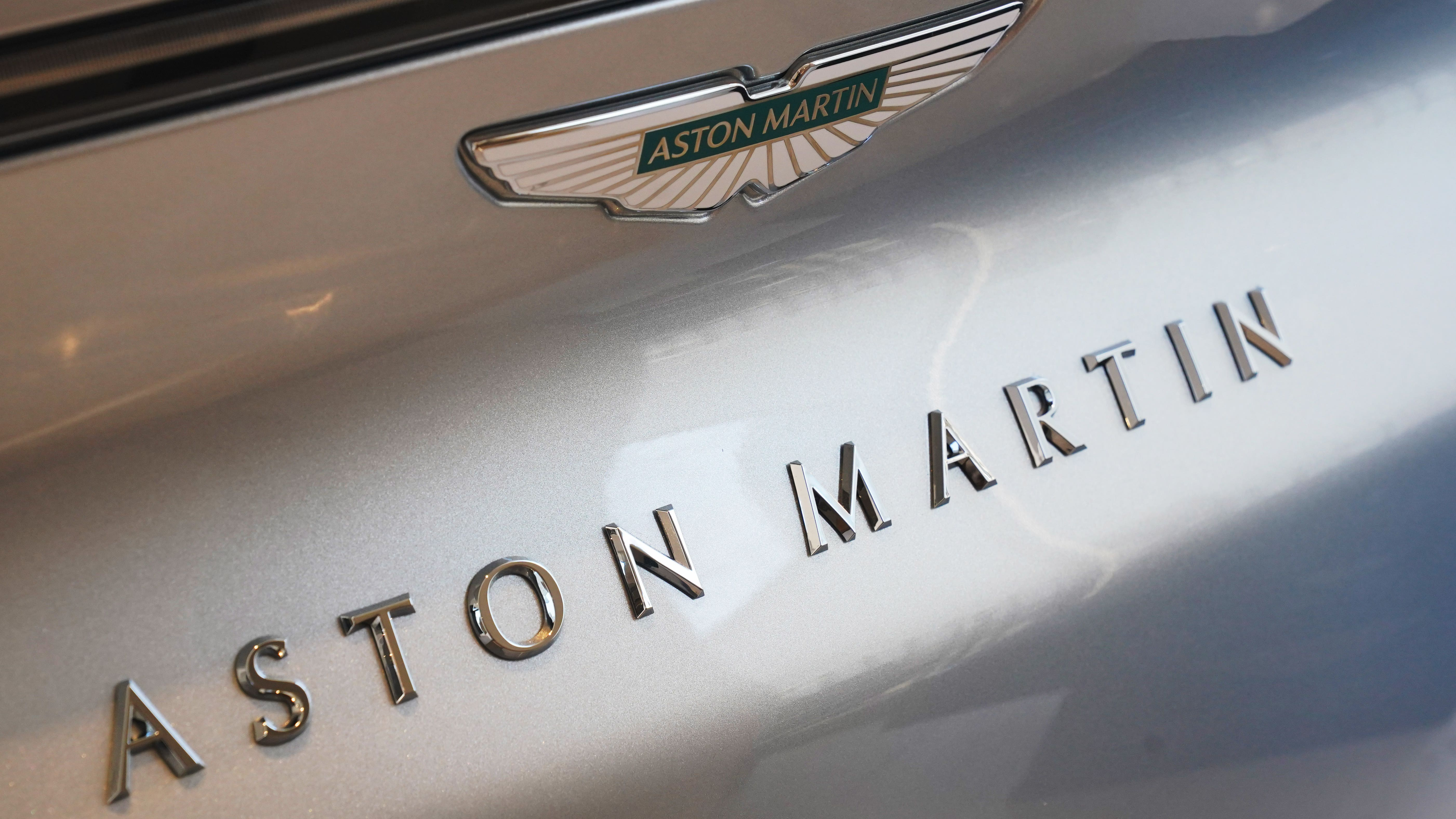 Aston Martin cuts £300M investment as losses double and sales fall 27%