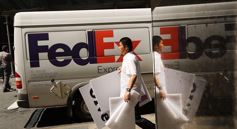 After frantically cutting costs for the last several months, FedEx announced it's laying off about 10% of its officers and directors.Spencer Platt/Getty Images