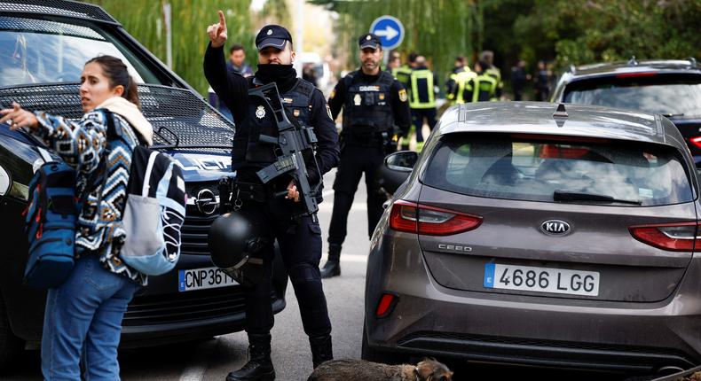 Spanish police stand outside of the Ukrainian embassy after a blast at the building injured one employee who was handling a letter in Madrid, Spain.Reuters