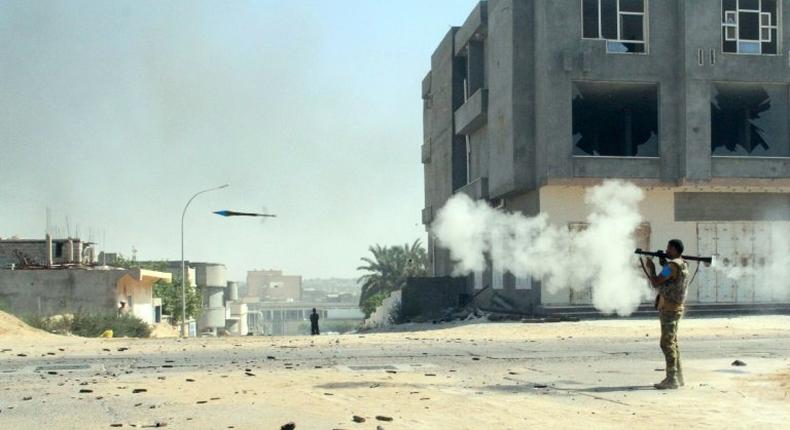 A pro-government fighter fires a rocket-propelled grenade launcher towards Islamic State group positions in Sirte on August 16, 2016 