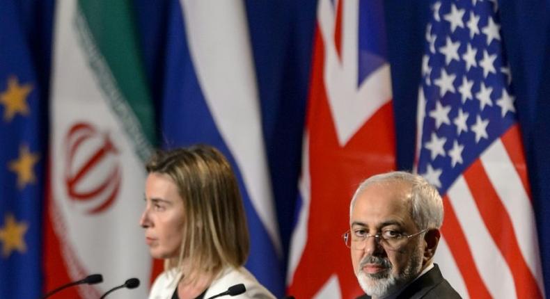 Iranian Foreign Minister Mohammad Javad Zarif (R) addressed a letter to EU's foreign policy chief Federica Mogherini (L) calling for a meeting of the commission