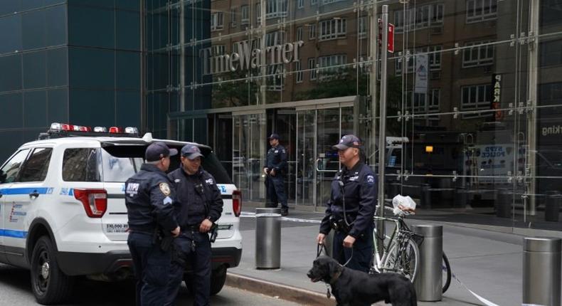 Police stand outside the Time Warner Building on October 24, 2018, after an explosive device was delivered to CNN's New York bureau