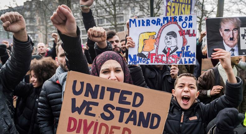 Demonstrators protest against President Donald Trump's executive order banning travelers from seven predominantly Muslim countries from entering the US.