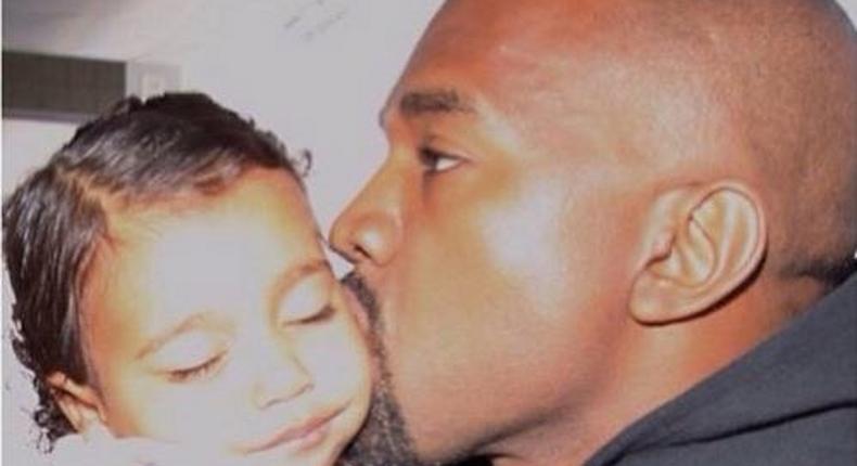 Kanye West kisses daughter North West