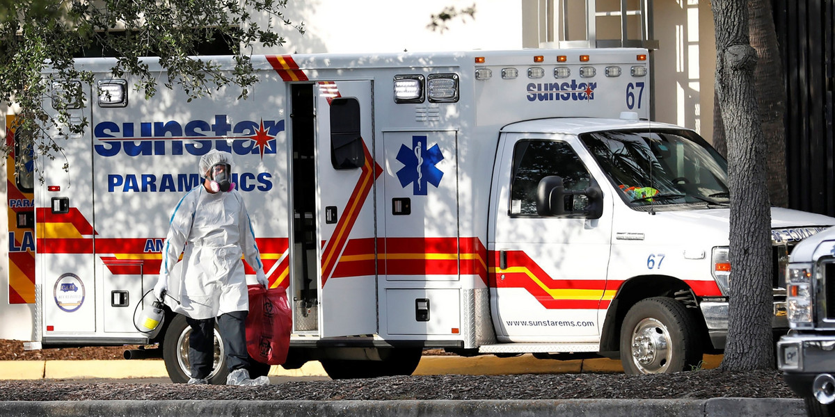 FILE PHOTO: People wait in long lines for COVID-19 testing in Houston