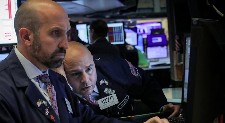 Traders work on the floor at the New York Stock Exchange (NYSE) in New York, U.S., May 13, 2019. REUTERS/Brendan McDermid