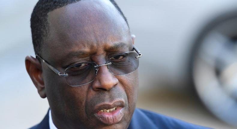 The former journalist had been charged for offending Senegal's President Macky Sall, pictured