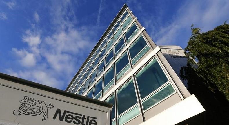 The Nestle logo is pictured on a truck outside the company's headquarters before the nine-month sale figures news conference in Vevey October 17, 2013. REUTERS/Denis Balibouse