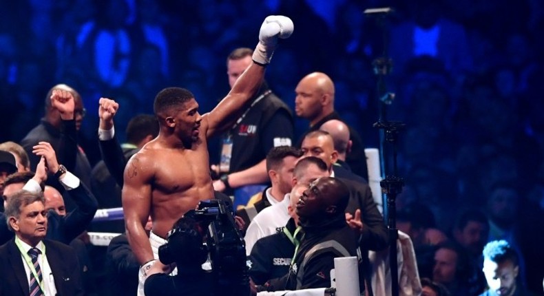 Britain's Anthony Joshua celebrates in the ring after his victory over Ukraine's Wladimir Klitschko in the eleventh round of their IBF, IBO and WBA, world Heavyweight title fight at Wembley Stadium in north west London on April 29, 2017