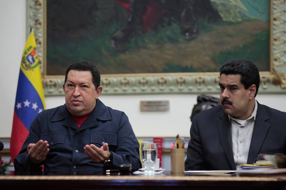 Venezuelan President Hugo Chavez speaks next to Vice President Nicolas Maduro during a national broadcast at Miraflores Palace in Caracas, December 8, 2012.