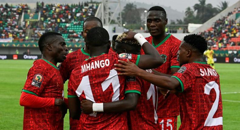 Malawi celebrate the first goal of Gabadinho Mhango (No 11) in an Africa Cup of Nations Group B match against Zimbabwe in the Cameroon city of Bafoussam on Friday. Creator: Pius Utomi EKPEI