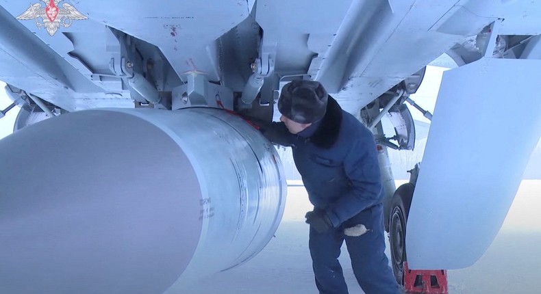 An airman checks a Russian Air Force MiG-31 fighter jet prior a flight with Kinzhal hypersonic missile during a drill in this still image taken from video released February 19, 2022.