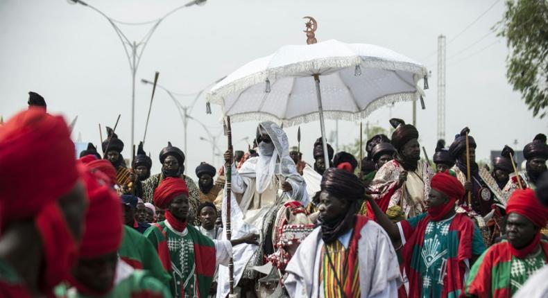 The Emir of Kano (C), Muhammadu Sanusi II is at the centre of tensions between new and old styles of governance