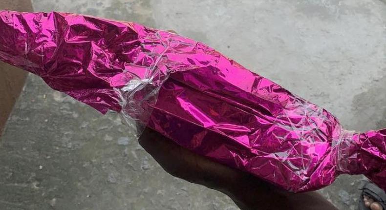 Confusion as bride receives wrapped cutlass from anonymous guest