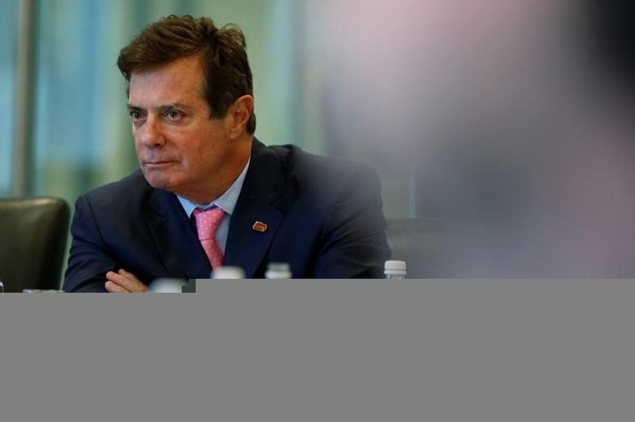 Paul Manafort listens during a national security meeting among Trump campaign officials.