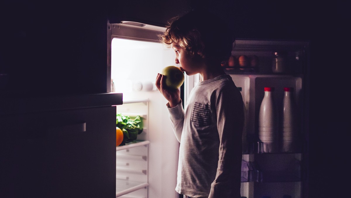 Little boy having a bedtime snack