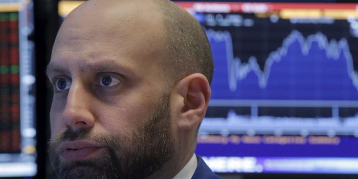 A specialist trader at his post on the floor of the New York Stock Exchange.