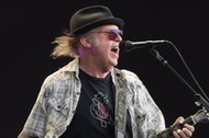 Neil Young performing live on stage in Hyde Park in London