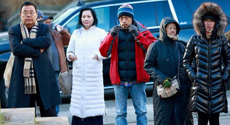 VANCOUVER, BC - DECEMBER 07: Observers stand outside the B.C. Supreme Courthouse as they wait for news at the bail hearing for Huawei Technologies Chief Financial Officer Meng Wanzhou in Vancouver on December 7, 2018 in Vancouver, Canada. Wanzhou was detained by border officials in Vancouver December 1 while changing flights en route to Mexico.