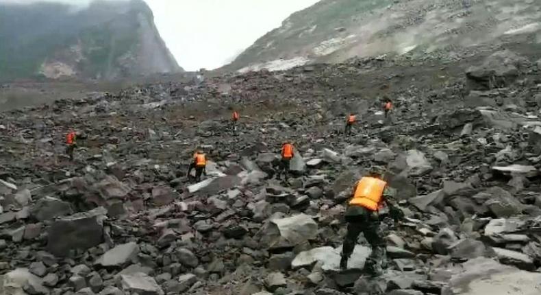 Some 40 homes in the village of Xinmo were swallowed by huge boulders after the side of a mountain collapsed, blocking a two kilometre (one mile) stretch of river