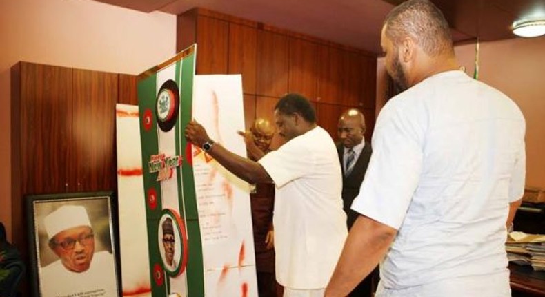 Raymond Dokpesi Jnr presents greeting cards to presidential aide, Femi Adesina